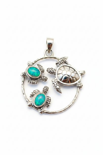 Colgante de Tortugas con dos ópalos. Plata de Ley